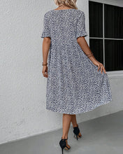 Laden Sie das Bild in den Galerie-Viewer, Elegantes Kleid mit Blumendruck und Rundhalsausschnitt